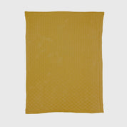 The in2green Basketweave Throw Blanket, in yellow and knitted from recycled yarns with a subtle basket-weave pattern, is shown flat on a white background.