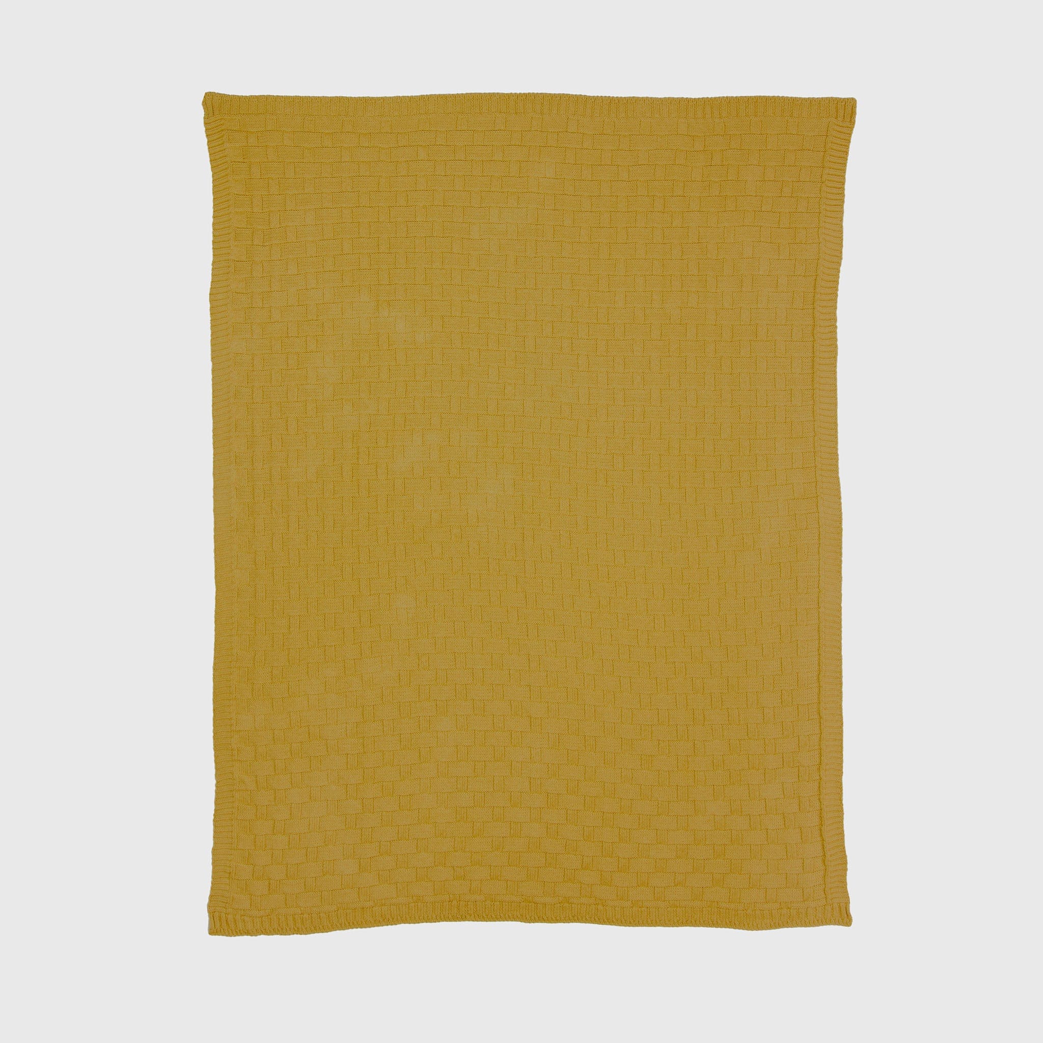The in2green Basketweave Throw Blanket, in yellow and knitted from recycled yarns with a subtle basket-weave pattern, is shown flat on a white background.