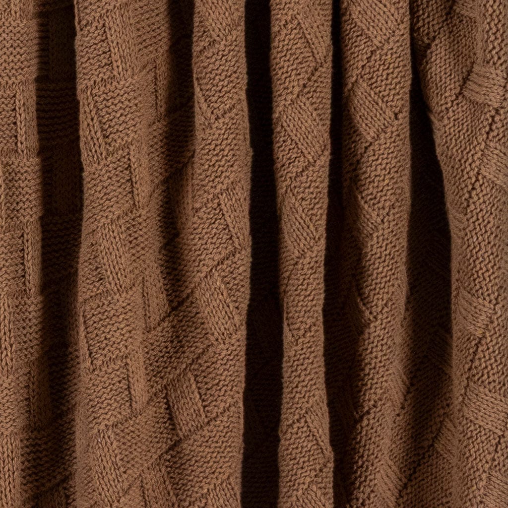Close-up of the in2green Basketweave Throw Blanket, made from sustainable recycled yarns with brown knitted fabric, vertical folds, and textured intersecting lines.