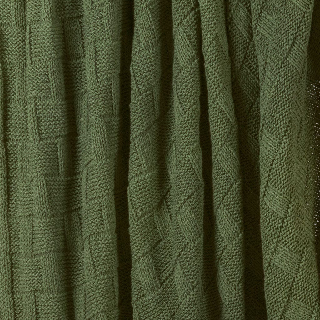 A close-up of the in2green Basketweave Throw Blanket, made with recycled yarns, highlights its detailed basket weave pattern and textured surface for a sustainable accent.