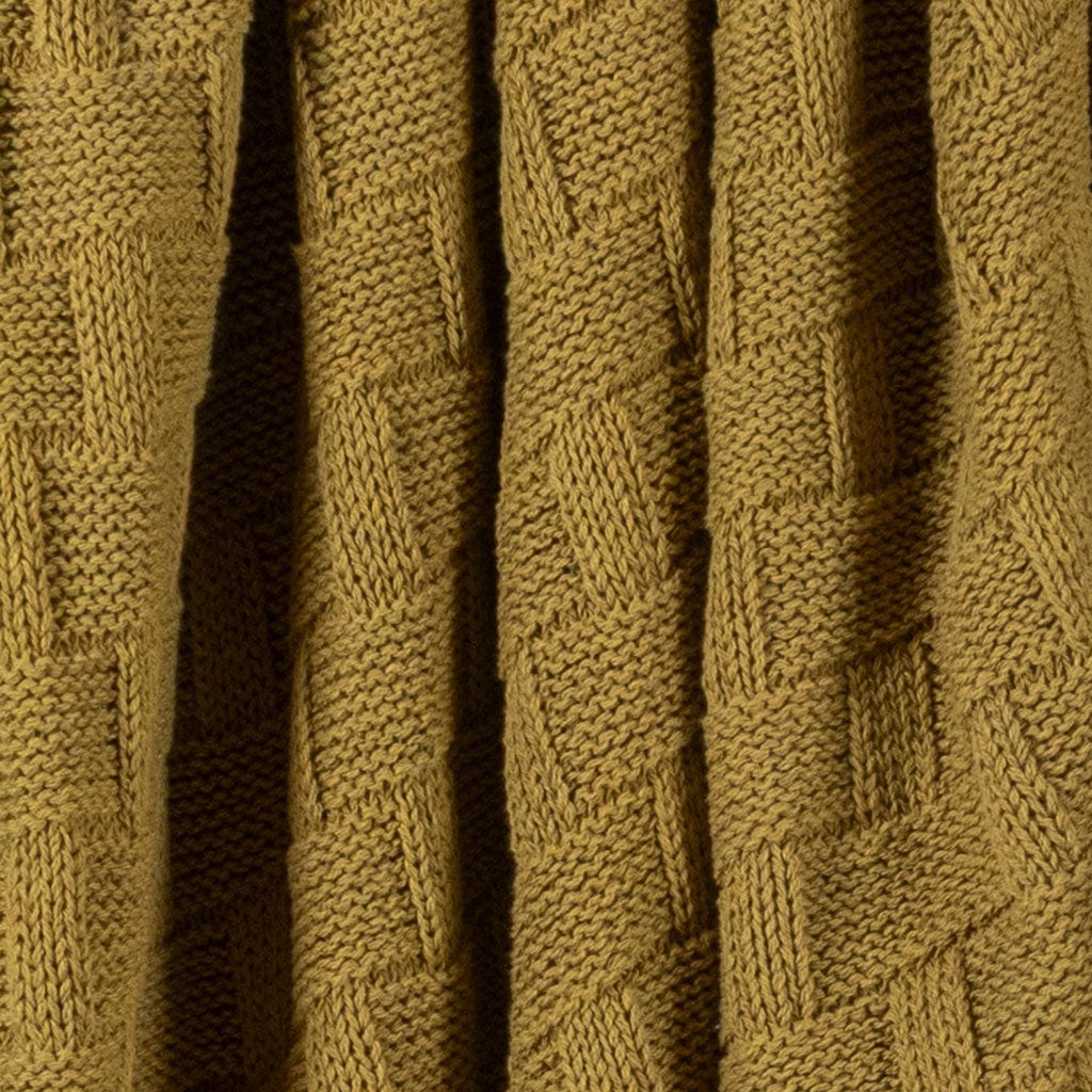 Close-up of the in2green Basketweave Throw Blanket in mustard, featuring a geometric square and rectangle pattern, crafted from sustainable recycled yarns.