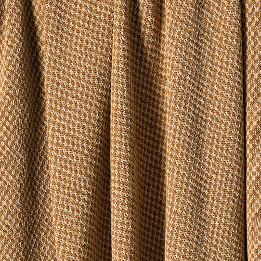 Close-up of brown and white checkerboard-patterned fabric with vertical folds, resembling the in2green Checkerboard Throw Blanket.