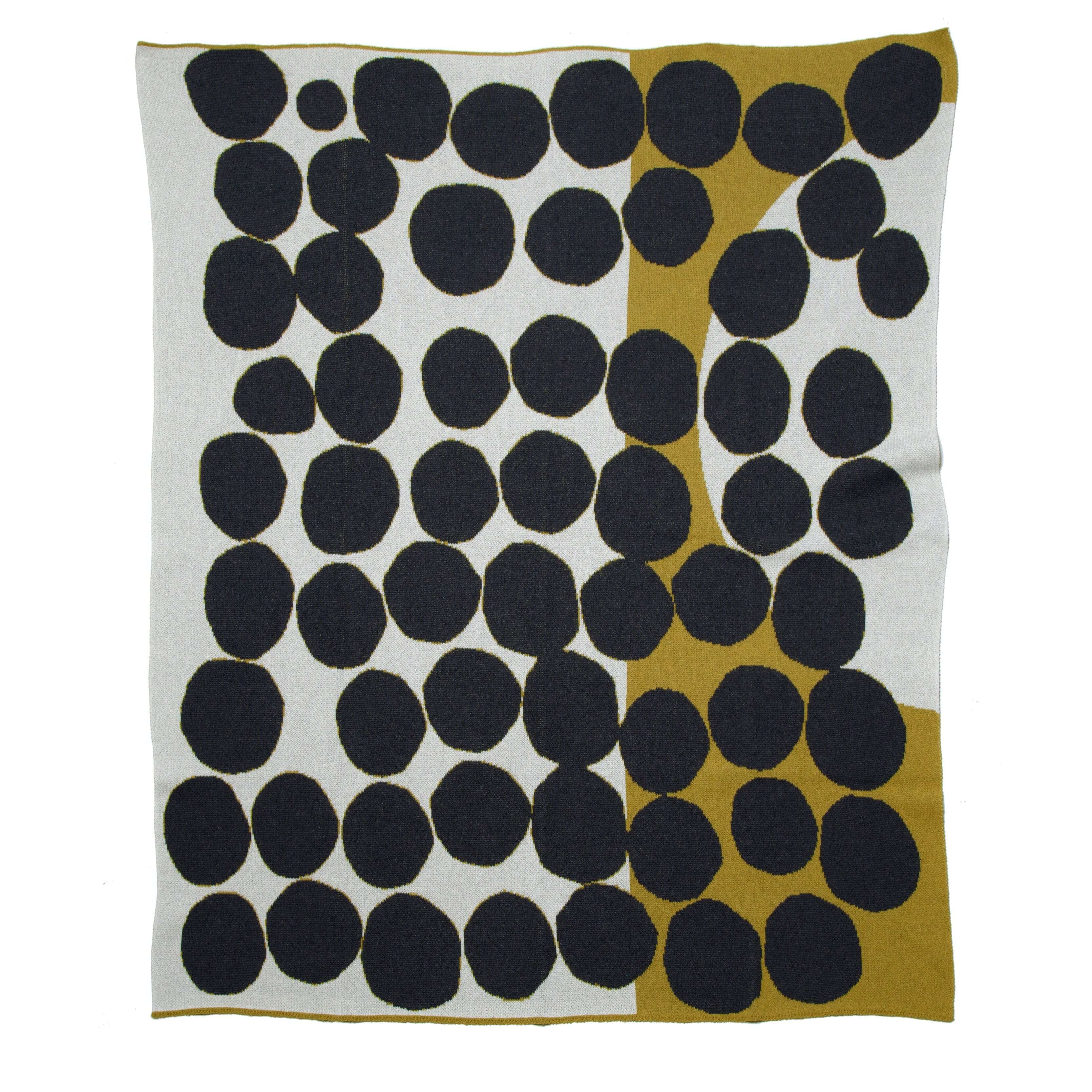 green, covered in dark grey circles.