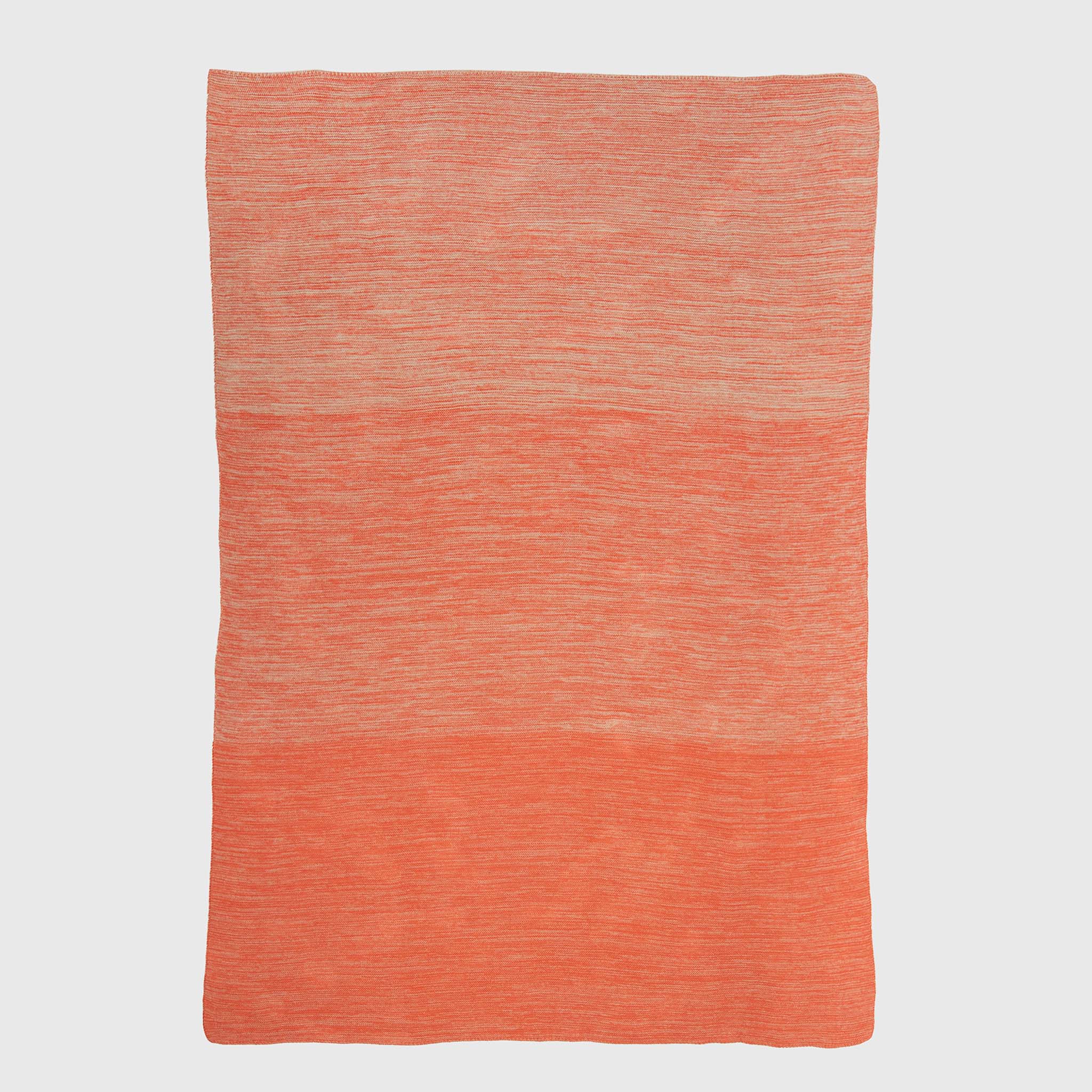 The in2green Textured Ombre Throw Blanket features a rectangular, ribbed design in two-tone orange, woven from recycled cotton and displayed flat on a white background.