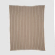 The in2green Poly Herringbone Edge Throw Blanket, crafted from recycled polyester in a subtle herringbone knit with vertical white stripes and a white border, is shown laid flat on a plain light grey background.