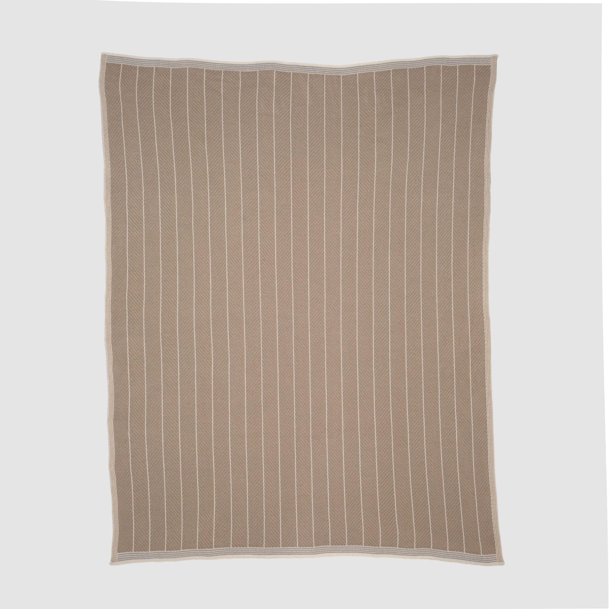 The in2green Poly Herringbone Edge Throw Blanket, crafted from recycled polyester in a subtle herringbone knit with vertical white stripes and a white border, is shown laid flat on a plain light grey background.