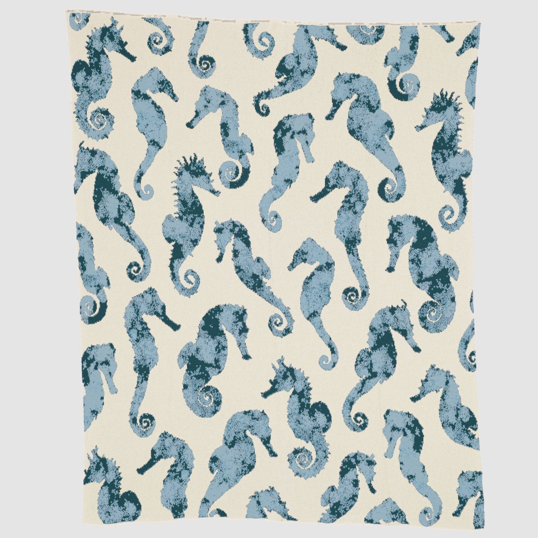 The In2Green Seahorse Watercolor Throw Blanket showcases blue variegated seahorses facing both directions on an off-white background, adding a drapable artful touch to your space.