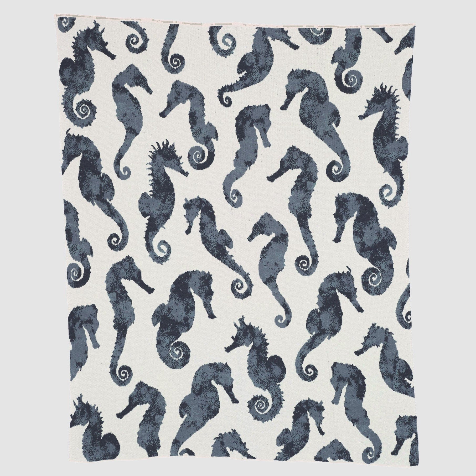 The Seahorse Watercolor Throw Blanket by In2Green features a lively pattern of colorful seahorses on white, bringing aquatic-inspired style and cozy comfort to your space.
