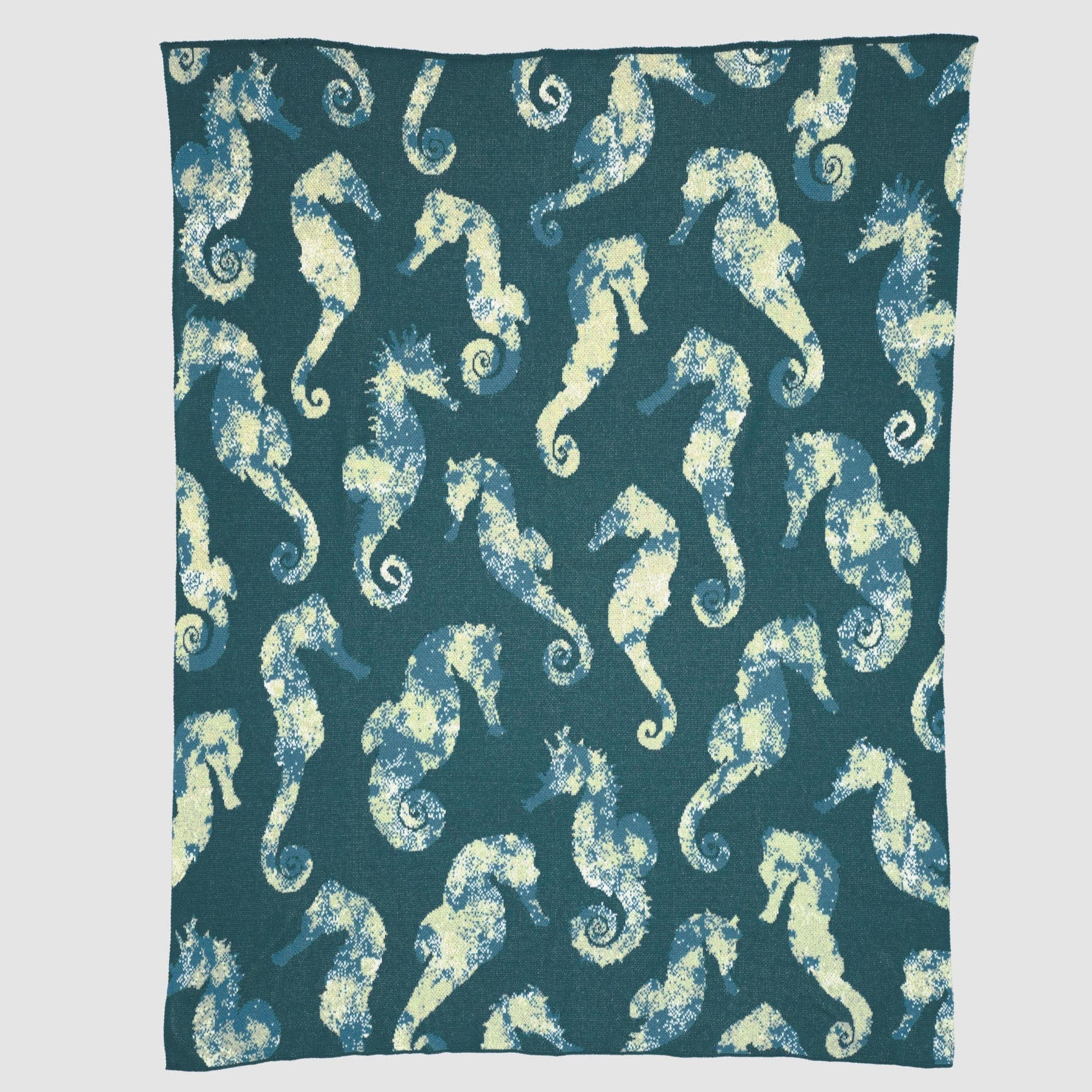 The In2Green Seahorse Watercolor Throw Blanket features yellow and blue seahorses in an aquatic design, repeating across a dark teal background.