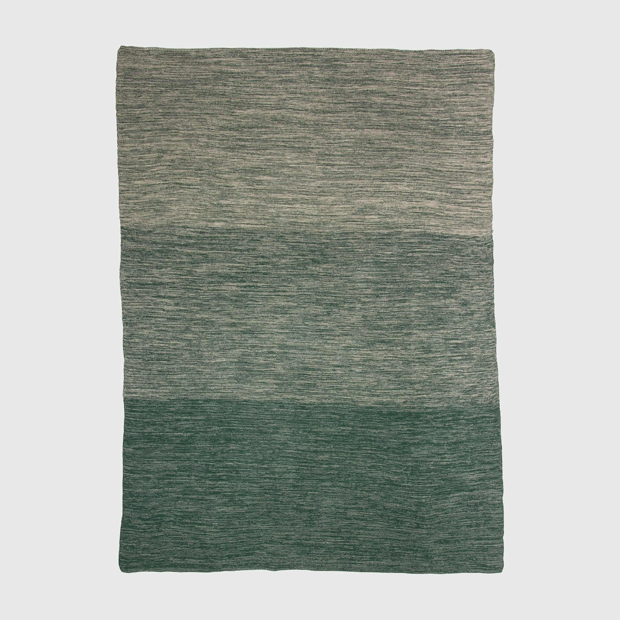 The in2green Textured Ombre Throw Blanket features three horizontal color blocks in green and gray with a subtle ribbed texture on a plain background.