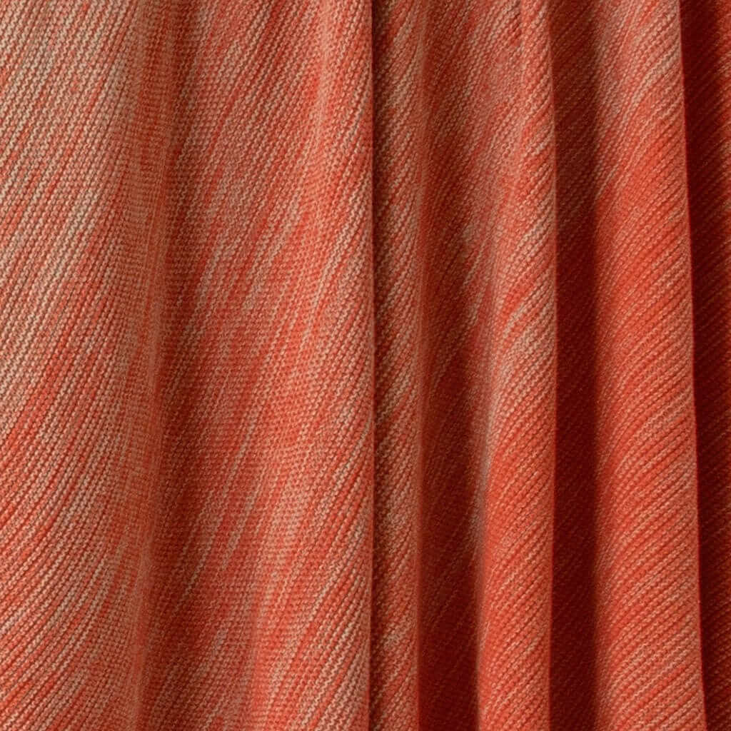 Close-up of the in2green Textured Ombre Throw Blanket in orange and beige, crafted from recycled cotton with diagonal lines and soft ribbed texture.