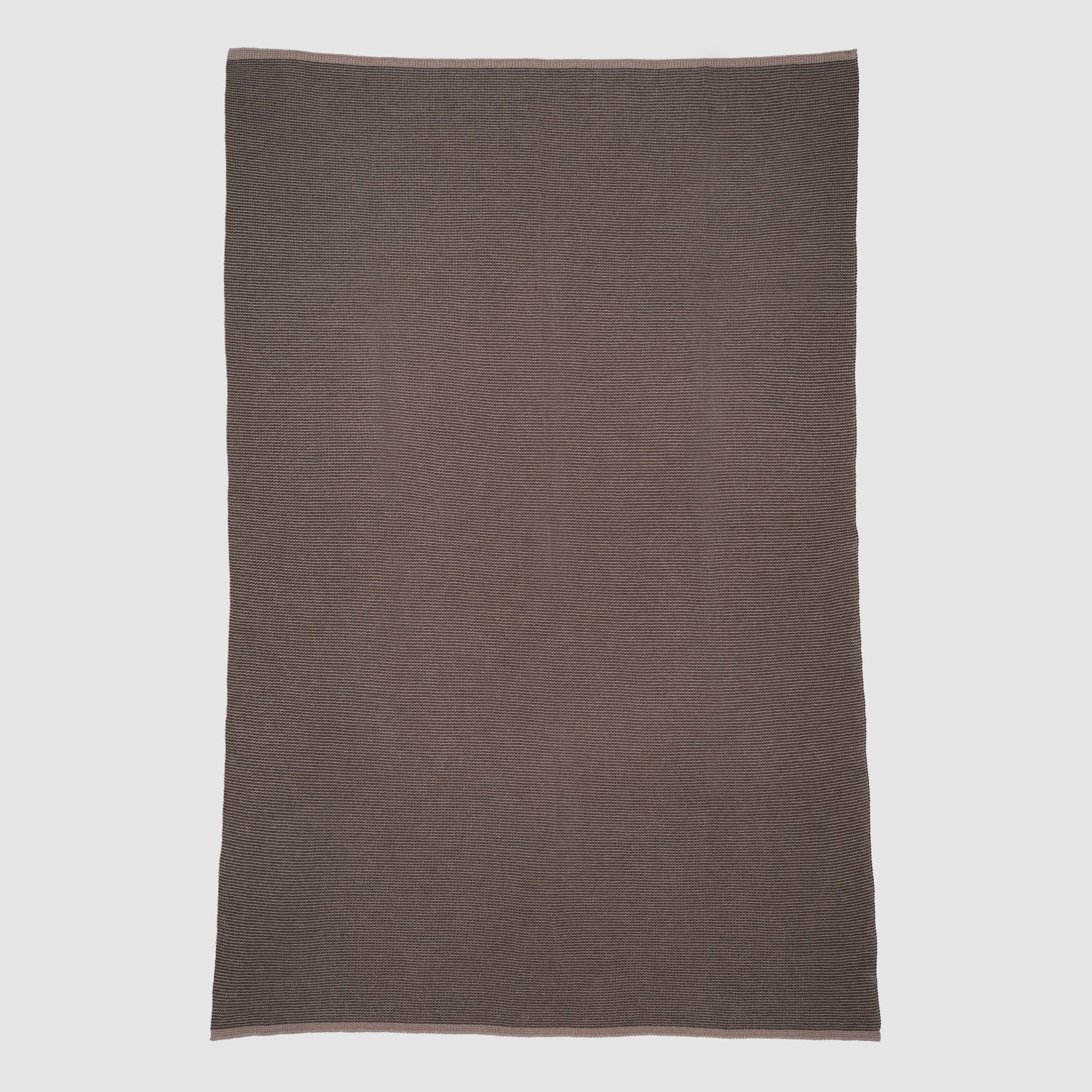 The in2green Wool Cardigan Throw Blanket, a rectangular solid brown piece with a textured surface, is laid flat on a light gray background.