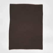 The in2green 100% Merino Wool Links Throw Blanket, a rectangular dark brown luxury throw with light-colored edges, is displayed flat against a plain white background.