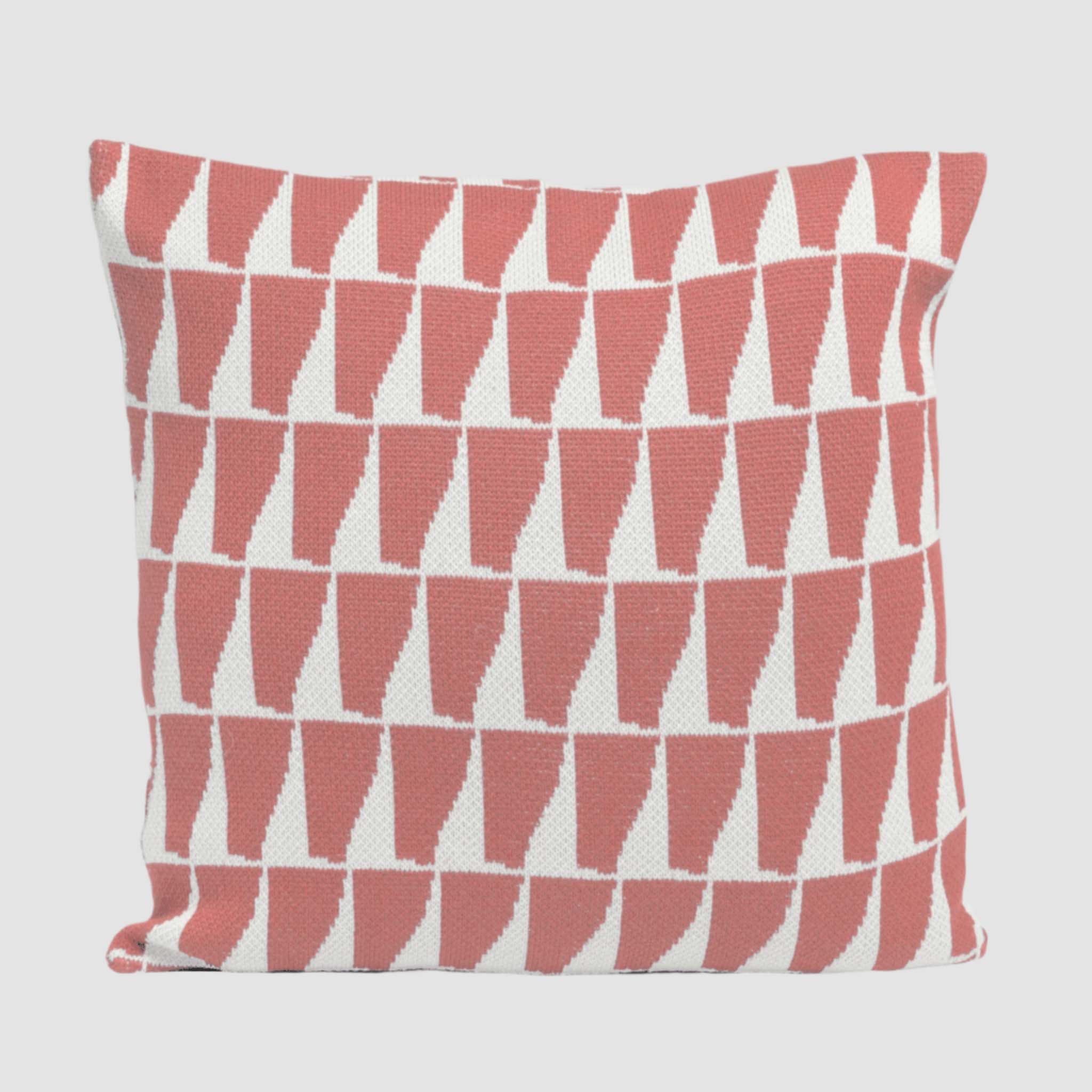 Add Nordic flair to your coastal decor with the Poly Tikku Pillow by Petra Kaksonen for in2green, featuring a bold geometric pattern of red and white triangles arranged in rows on a plain background.