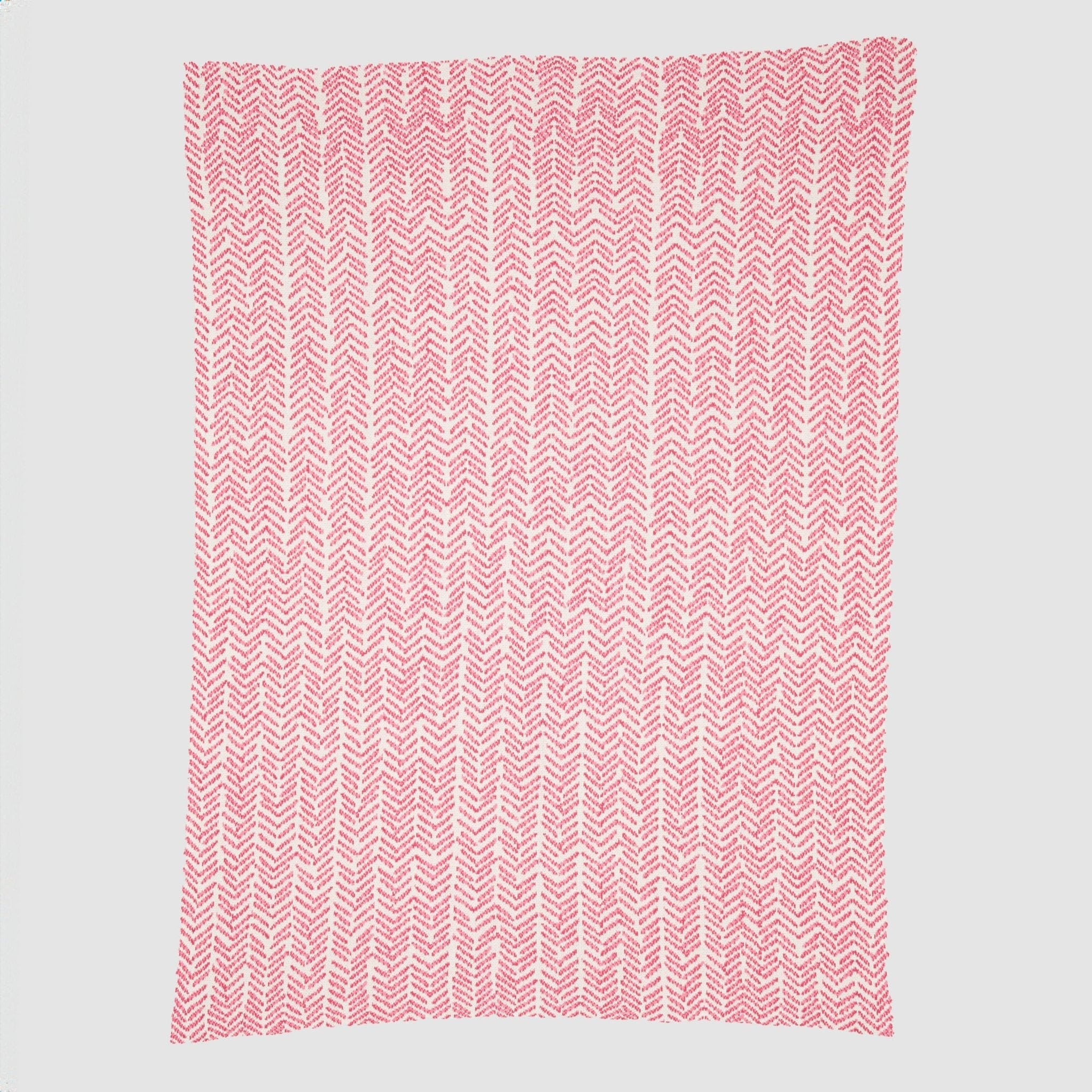 Introducing the In2Green Warrior Throw Blanket Pink: a cozy knitted blanket featuring a pink and white herringbone pattern. Designed for comfort, it offers warmth and support during chemotherapy sessions, symbolizing hope for breast cancer warriors.