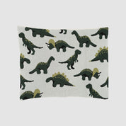 The Baby Dinosaur Blanket is a white rectangular baby blanket featuring a repeating pattern of green cartoon dinosaurs, including playful T-Rex and Stegosaurus in various poses.