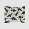 The Baby Dinosaur Blanket is a white rectangular baby blanket featuring a repeating pattern of green cartoon dinosaurs, including playful T-Rex and Stegosaurus in various poses.