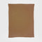 The in2green Basketweave Throw Blanket, rectangular and light brown, made from sustainable recycled yarns, is displayed flat on a white background.
