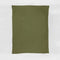 The in2green Basketweave Throw Blanket, olive green and rectangular with a subtle checkered knit from sustainable recycled yarns, is laid flat on a white background.