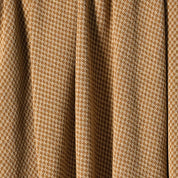 Close-up of brown and white checkerboard-patterned fabric with vertical folds, resembling the in2green Checkerboard Throw Blanket.