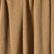 Close-up of brown and white checkerboard-patterned fabric with vertical folds, resembling the in2green Checkerboard Throw Blanket.