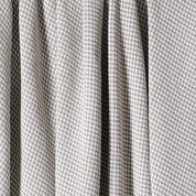 The in2green Checkerboard Throw Blanket features a gray and white houndstooth pattern with soft folds and draping, ideal for a modern touch to your space.
