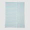 The Coastal Stripes Throw Blanket features horizontal light blue and white stripes on the left and vertical stripes on the right, creating a breezy seaside-inspired look against a plain background.