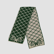 The in2green Equestrian Plaid Scarf is an eco-friendly accessory featuring a green and beige diamond pattern with horse head details at both ends.