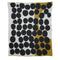The Huey Throw Blanket by Susy Pilgrim Waters is a sustainable cotton throw with irregular black circles on white, accented by mustard yellow on the right edge and lower left—ideal for fans of modern illustrator-inspired design.