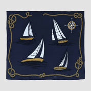 Navy blue blanket with sailboat and compass design.