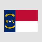 The Hometown Pride Flag - Cotton Sustainable Knit Blanket by in2green showcases the striking design of the North Carolina state flag, with its bold blue stripe featuring a white star, two important dates, and the letters “N” and “C,” set beside classic horizontal red and white stripes—an eye-catching tribute made into a cozy, USA-made blanket.