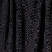 Close-up of in2green Wool Cardigan Throw Blanket in black, showing washable wool fabric with vertical folds and a subtle diagonal weave pattern.