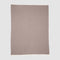 The in2green 100% Merino Wool Links Throw Blanket is a minimalist, light brown throw with a white border, crafted from soft wool and displayed flat on a light grey background.