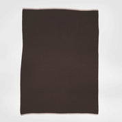 The in2green 100% Merino Wool Links Throw Blanket, a rectangular dark brown luxury throw with light-colored edges, is displayed flat against a plain white background.