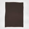 The in2green 100% Merino Wool Links Throw Blanket, a rectangular dark brown luxury throw with light-colored edges, is displayed flat against a plain white background.