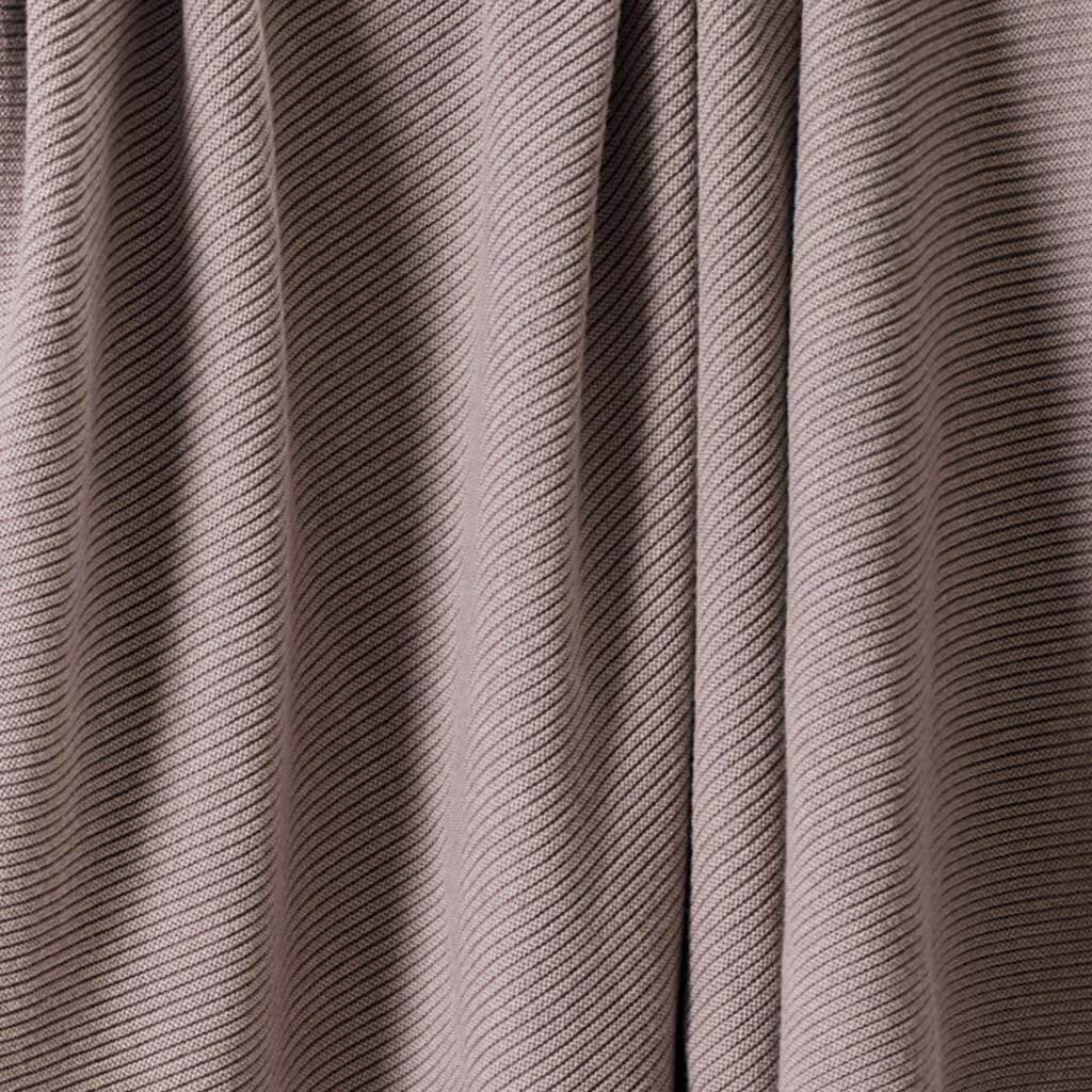 Close-up view of the in2green 100% Merino Wool Links Throw Blanket in beige or taupe, featuring a subtle diagonal textured pattern—an elegant luxury accent for minimalist interiors.