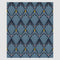 The Art Deco Shells Throw Blanket by in2green features blue fan-like shapes outlined in black and white on a dark background, enhanced with small yellow accents for vintage glamour. It's woven from sustainable yarns, adding an eco-friendly touch.