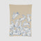 The in2green Baby Rabbits Blanket is a charming beige throw made from recycled cotton, featuring white rabbits outlined in blue, some playfully holding or playing with balls—perfect for gender-neutral decor.