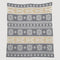 The Fair Isle with Skis Throw Blanket by in2green exudes Swiss chalet charm, featuring snowflakes and crossed skis in white and beige against a gray backdrop.