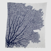 Add coastal flair to your beach house with the in2green Fan Coral Throw Blanket, featuring a white fabric accented by dark blue coral branches spreading from the lower left corner—a chic and stylish addition to any space.