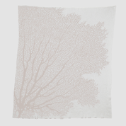 The in2green Fan Coral Throw Blanket features a white coral design with light pink branches, ideal for adding coastal charm to beach houses.