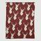 The in2green Oh Deer Throw Blanket is a cozy maroon addition, featuring a repeating pattern of white stag silhouettes, ideal for enhancing your cabin decor with an outdoor touch.