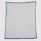 The in2green Poly Woven Square Throw Blanket features a blue border, white background, and repeating diamond pattern in durable outdoor fabric—ideal for elevating your outdoor space.