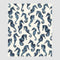 The Seahorse Watercolor Throw Blanket by in2green features blue seahorses on a light background, made from recycled cotton for an eco-friendly, stylish, and sustainable design.
