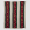 The Striped Horse Bit Throw Blanket by in2green is part of the Equestrian Collection and features vertical stripes in beige, green, and red. Made from recycled cotton, its eco-friendly design showcases red stripes with a unique chain pattern reminiscent of a horse bit.