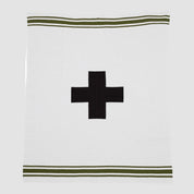 The in2green Swiss Cross with Stripes Throw Blanket is a white recycled knit featuring a central black Eco Swiss Cross, bordered by two green stripes near the top and bottom edges.
